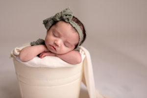Baby in green photoshoot in Janesville, Wisconsin
