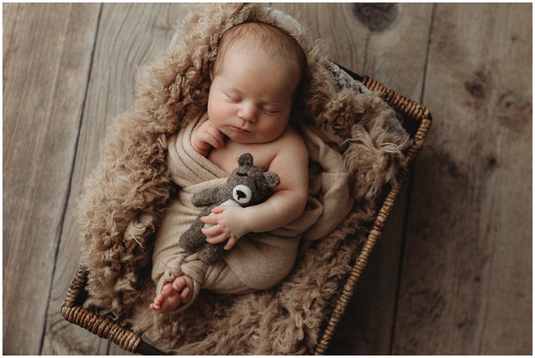 Newborn baby with props in Janesville, Wisconsin
