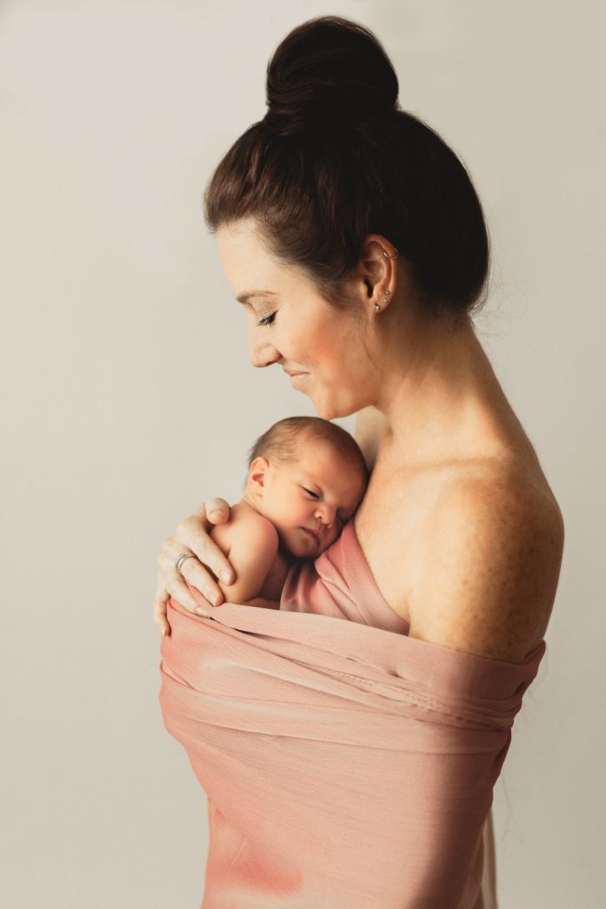 Newborn baby with mom by Olivia Acton Photography in Janesville, WI