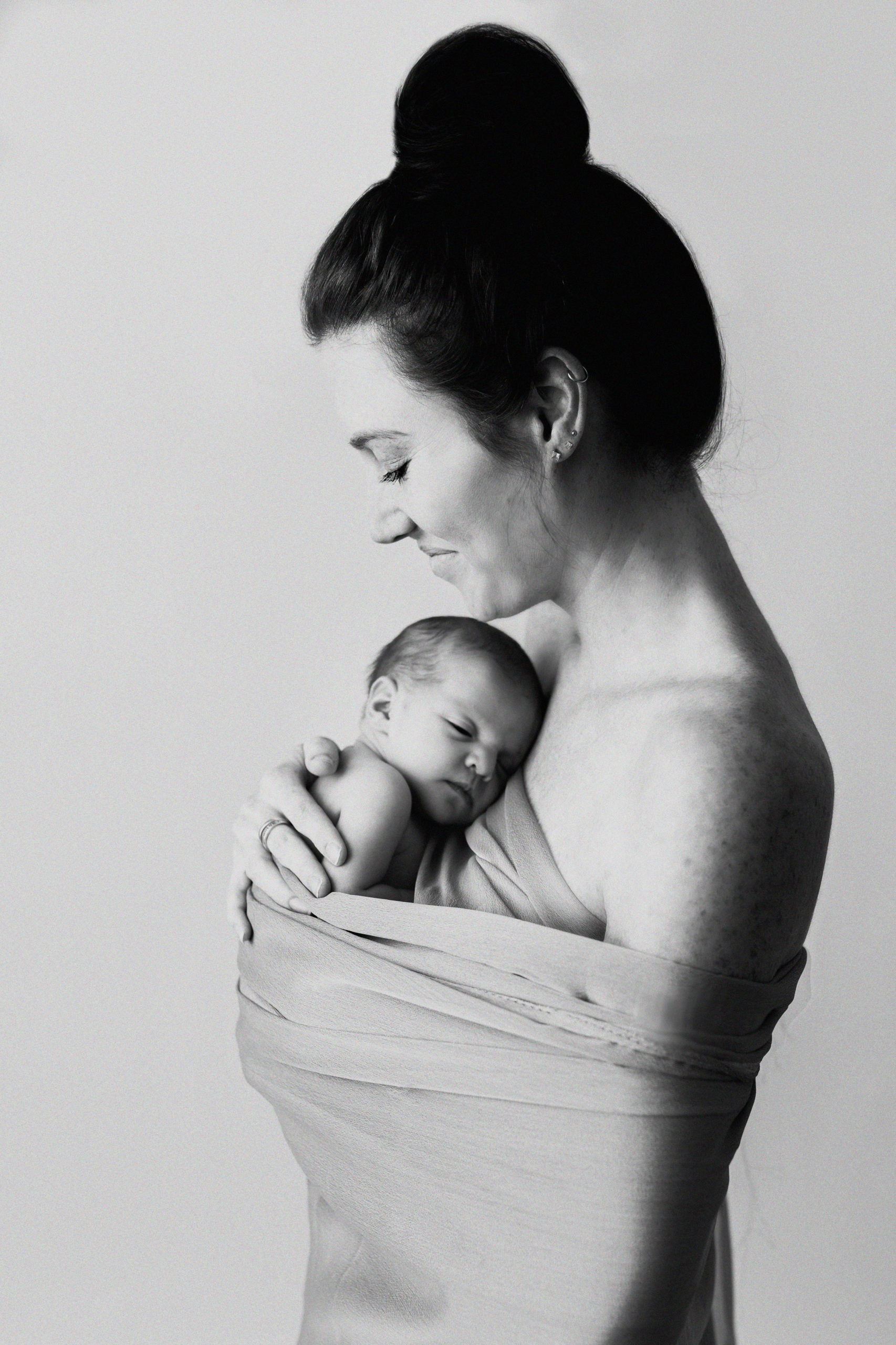 Newborn baby with mom by Olivia Acton Photography in Janesville, WI