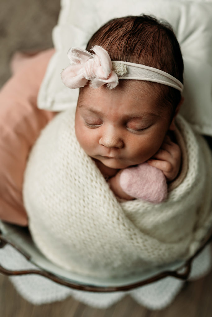 Newborn girl in props in Janesville, WI