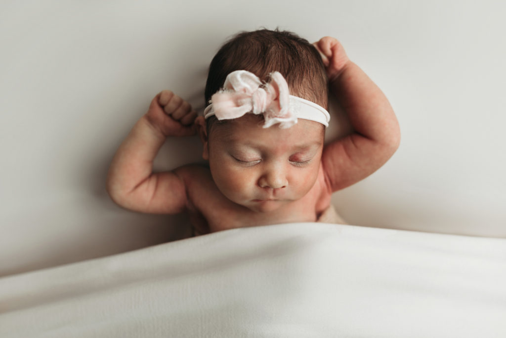 Newborn girl in props in Janesville, WI by Olivia Acton Photography