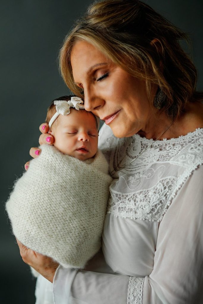Grandma and baby during newborn session in Janesville, WI