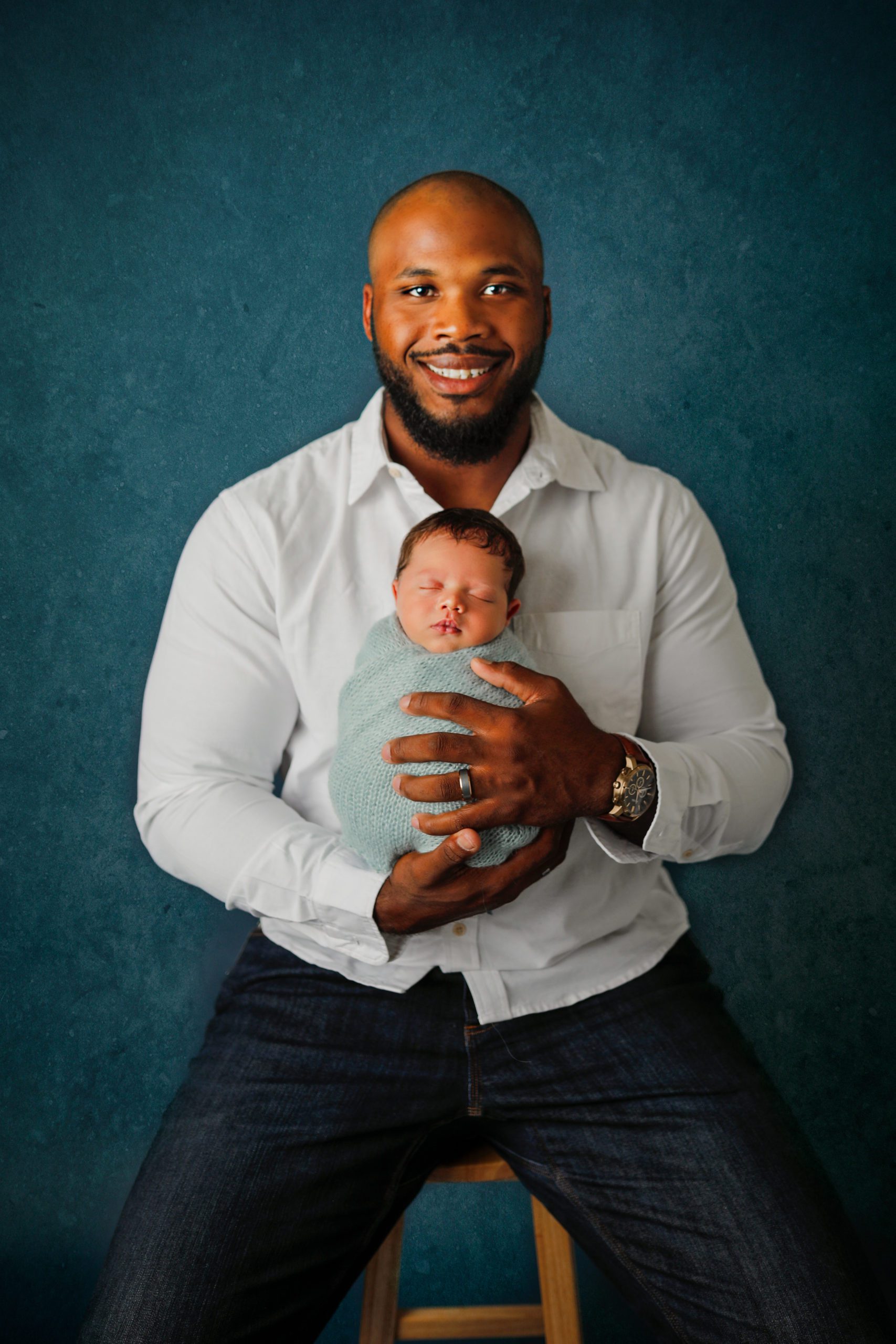 Newborn baby with dad by Olivia Acton Photography in Janesville, WI