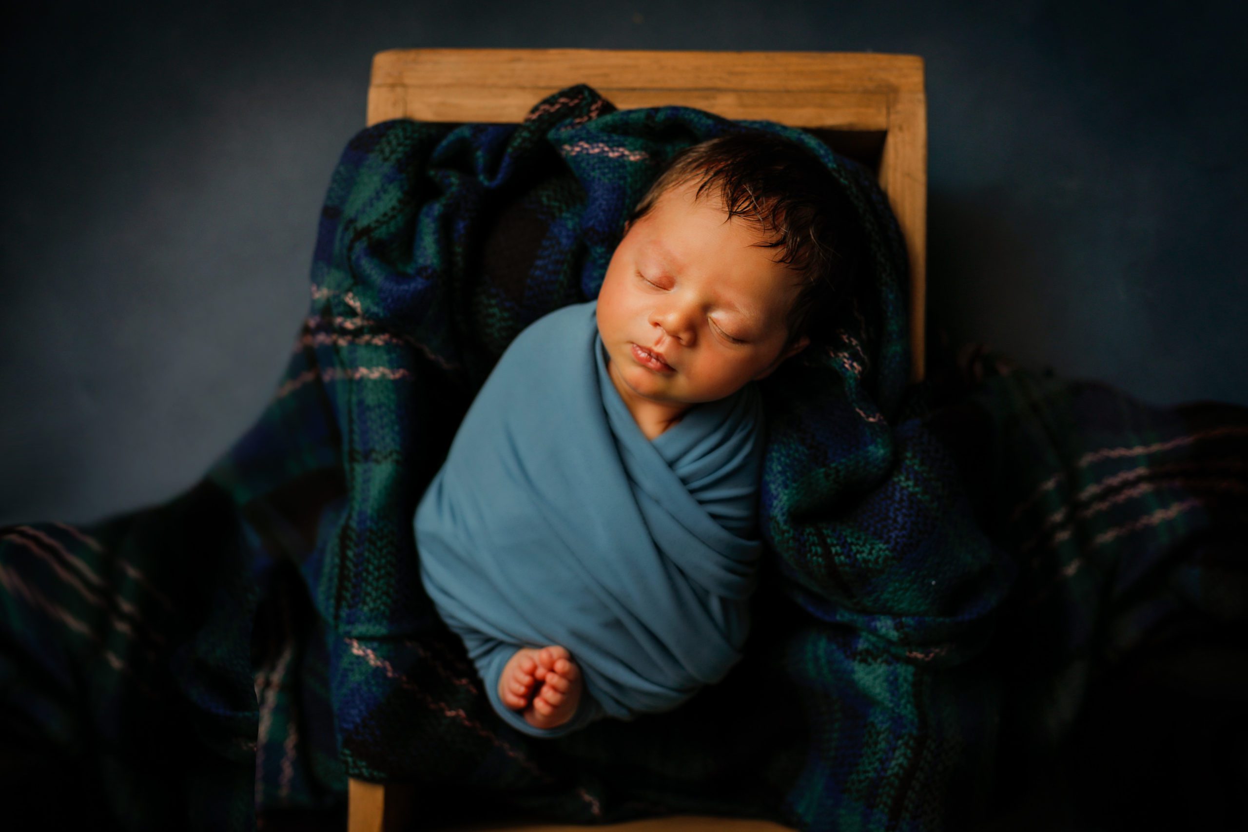Newborn boy in props in Janesville, WI